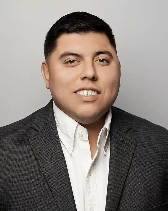 Cash House Buyer Austin, TX - headshot of Justin DonJuan in a grey suit pays cash for houses