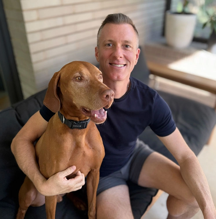 Austin's #1 Cash House Buyer - We Buy Houses in Austin for Cash Portrait of Robert Grunnah of Austin House Buyer sitting with his dog. Austin's Top Cash House Buyer helps people sell their house fast for cash.